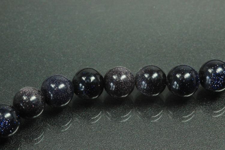 Blue sand stone spherical gemstone strand, approx. dimensions  8mm, approx. 39,0 - 40,0cm long.