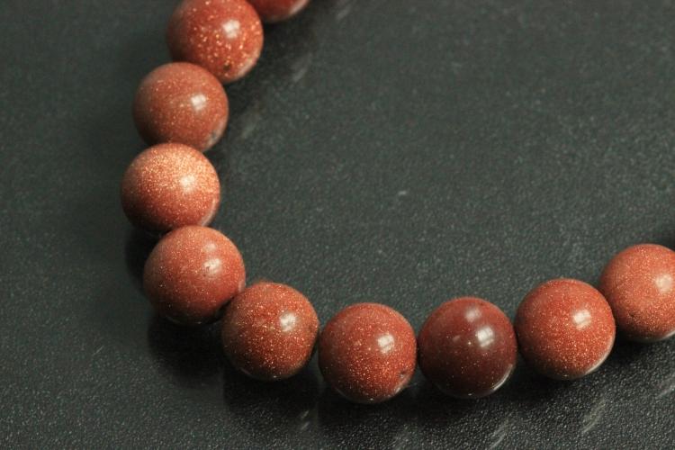 Gold sand stone spherical gemstone strand, approx. dimensions  8mm, approx. 39,0 - 40,0cm long.