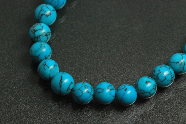 Turquoise reconstructed spherical gemstone strand, approx. dimensions  8mm, approx. 39,0 - 40,0cm long.