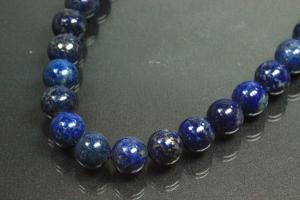 Lapis Lazuli spherical gemstone strand blue, approx. dimensions  10mm, approx. 39,5cm long. Quality feature A. This gemstone strand was provisionally strung on blue pearl silk for further processing.