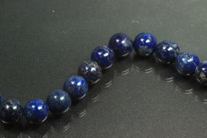 Lapis Lazuli spherical gemstone strand blue, approx. dimensions  10mm, approx. 39,5cm long. Quality feature A. This gemstone strand was provisionally strung on blue pearl silk for further processing.