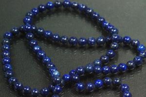 Lapis Lazuli spherical gemstone strand blue, approx. dimensions  4mm, approx. 39,5cm long. Quality feature A. This gemstone strand was provisionally strung on blue pearl silk for further processing.