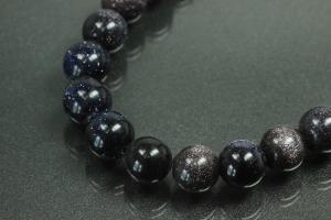 Blue sand stone spherical gemstone strand, approx. dimensions  8mm, approx. 39,0 - 40,0cm long.