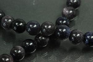 Blue sand stone spherical gemstone strand, approx. dimensions  8mm, approx. 39,0 - 40,0cm long.