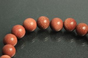 Gold sand stone spherical gemstone strand, approx. dimensions  8mm, approx. 39,0 - 40,0cm long.