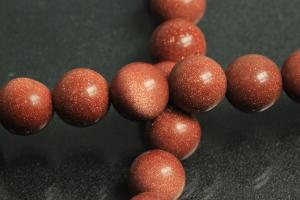 Gold sand stone spherical gemstone strand, approx. dimensions  8mm, approx. 39,0 - 40,0cm long.