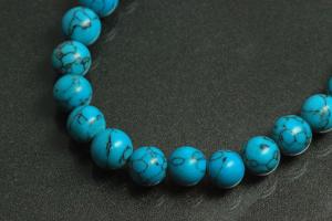 Turquoise reconstructed spherical gemstone strand, approx. dimensions  8mm, approx. 39,0 - 40,0cm long.