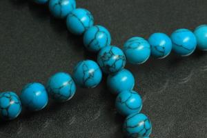 Turquoise reconstructed spherical gemstone strand, approx. dimensions  8mm, approx. 39,0 - 40,0cm long.