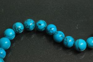 Turquoise reconstructed spherical gemstone strand, approx. dimensions  8mm, approx. 39,0 - 40,0cm long.